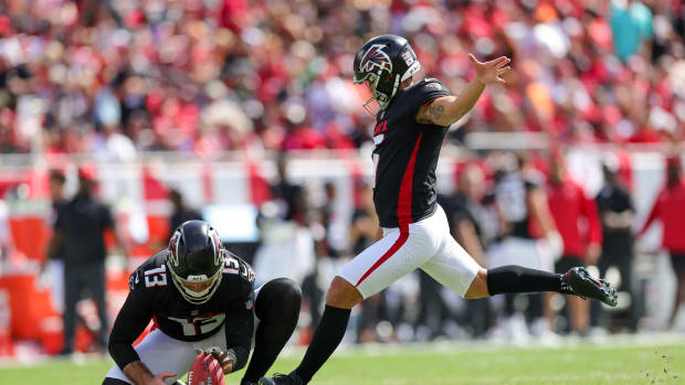 Oct 22, 2023; Tampa, Florida, USA; Atlanta Falcons place kicker Younghoe Koo (6) kicks a field goal held by Atlanta Falcons punter Bradley Pinion (13) against the Tampa Bay Buccaneers in the first quarter at Raymond James Stadium. Mandatory Credit: Nathan Ray Seebeck-USA TODAY Sports